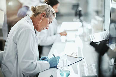 A scientist following a research protocol in the lab.